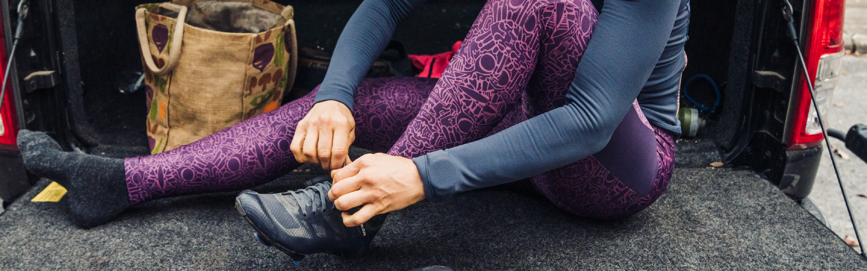 Cyclist Lacing Up Shoes Before a Ride